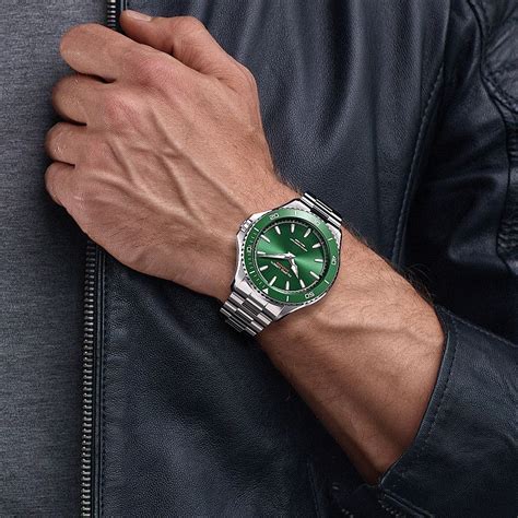 green face watch leather strap.